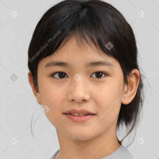 Joyful asian child female with medium  brown hair and brown eyes