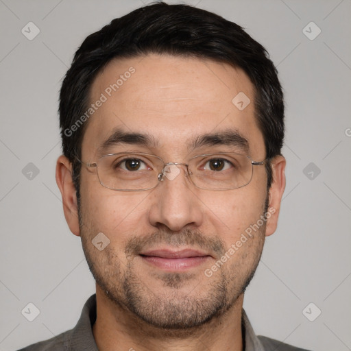 Joyful white adult male with short  black hair and brown eyes
