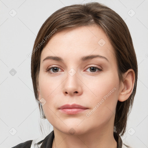 Neutral white young-adult female with medium  brown hair and grey eyes