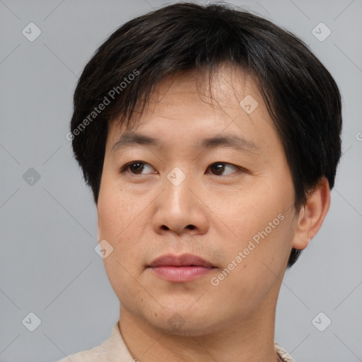 Neutral asian young-adult male with short  brown hair and brown eyes