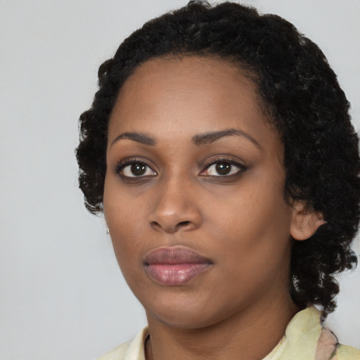 Neutral black young-adult female with medium  black hair and brown eyes