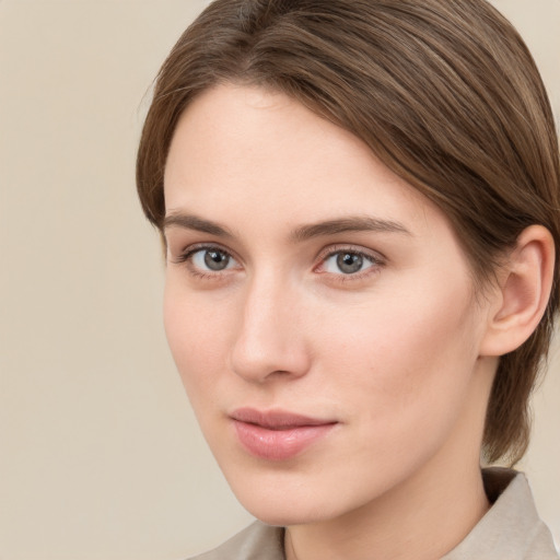 Neutral white young-adult female with medium  brown hair and grey eyes