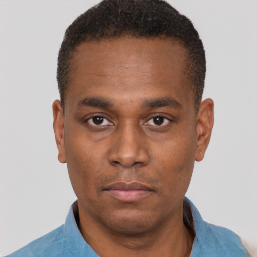 Neutral black young-adult male with short  brown hair and brown eyes