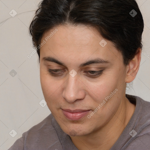 Joyful white adult female with medium  brown hair and brown eyes