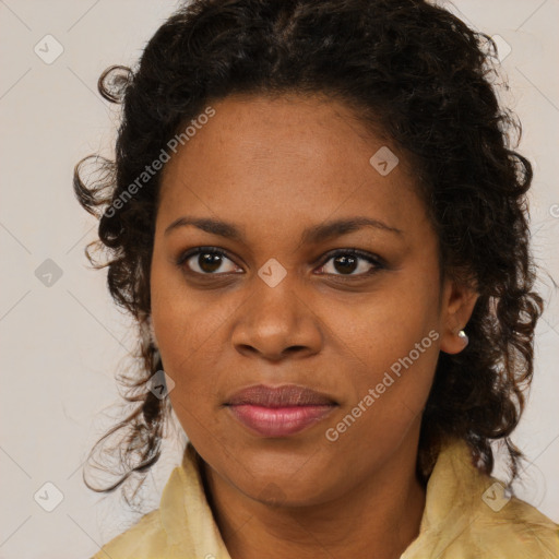 Joyful black young-adult female with long  brown hair and brown eyes