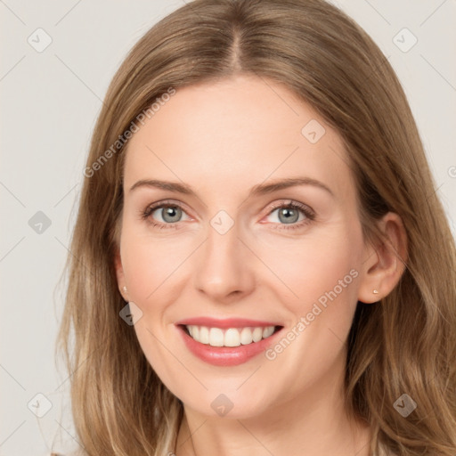 Joyful white young-adult female with long  brown hair and blue eyes