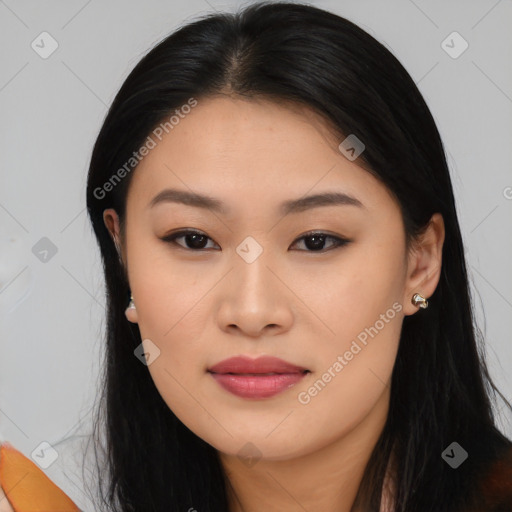 Joyful asian young-adult female with long  black hair and brown eyes