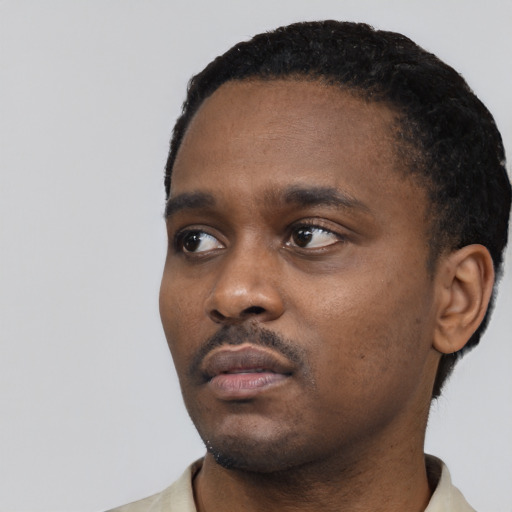 Neutral black young-adult male with short  black hair and brown eyes