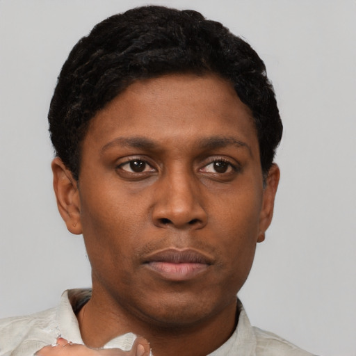 Neutral black young-adult male with short  brown hair and brown eyes