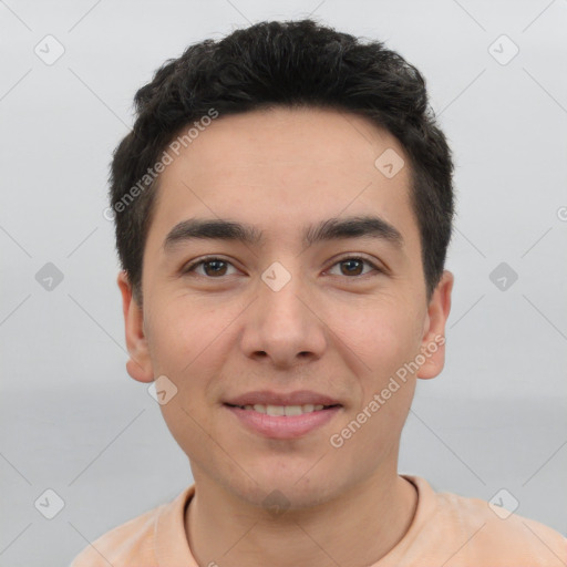 Joyful white young-adult male with short  black hair and brown eyes