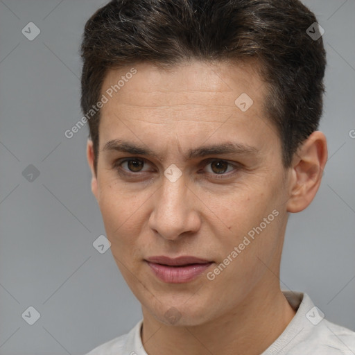 Joyful white adult male with short  brown hair and brown eyes