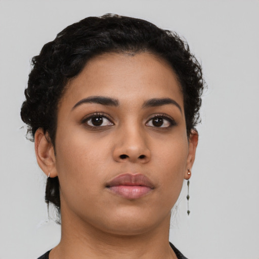 Neutral latino young-adult female with short  black hair and brown eyes