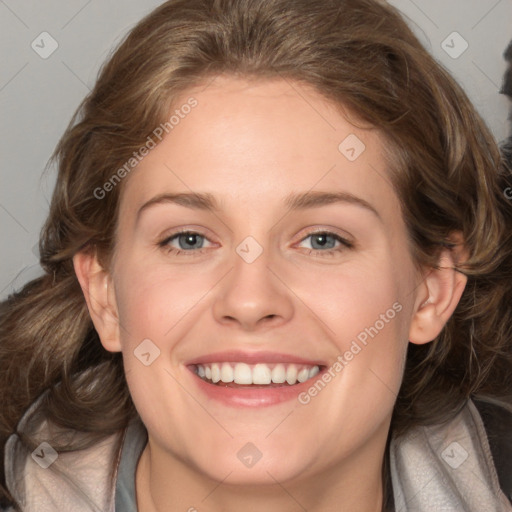 Joyful white adult female with medium  brown hair and grey eyes