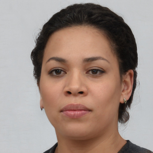 Neutral latino young-adult female with medium  brown hair and brown eyes