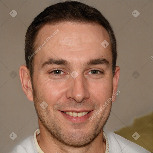 Joyful white adult male with short  brown hair and brown eyes