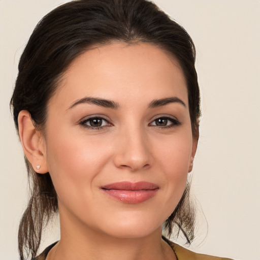 Joyful white young-adult female with medium  brown hair and brown eyes