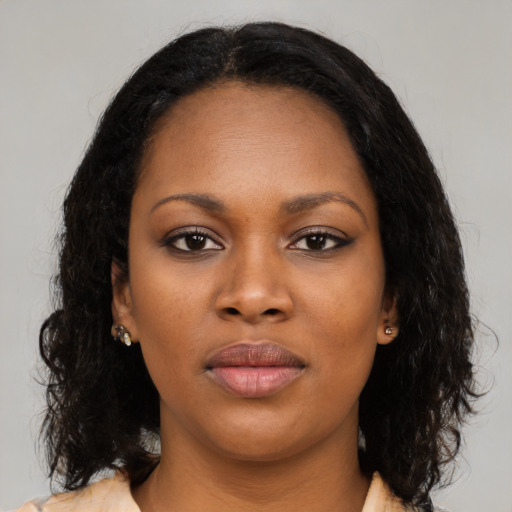 Joyful black young-adult female with medium  black hair and brown eyes