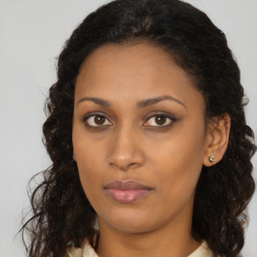 Neutral black young-adult female with medium  brown hair and brown eyes