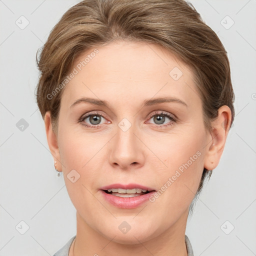 Joyful white young-adult female with short  brown hair and grey eyes