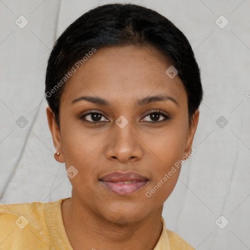 Joyful black young-adult female with short  brown hair and brown eyes