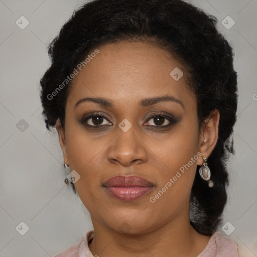 Joyful black adult female with medium  brown hair and brown eyes