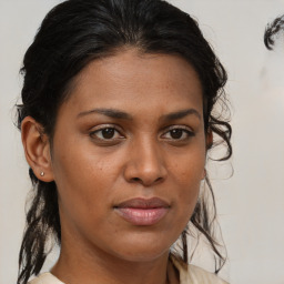 Joyful black young-adult female with medium  brown hair and brown eyes