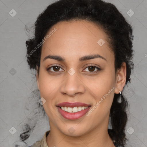 Joyful black young-adult female with medium  brown hair and brown eyes