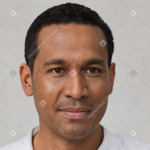 Joyful latino adult male with short  black hair and brown eyes