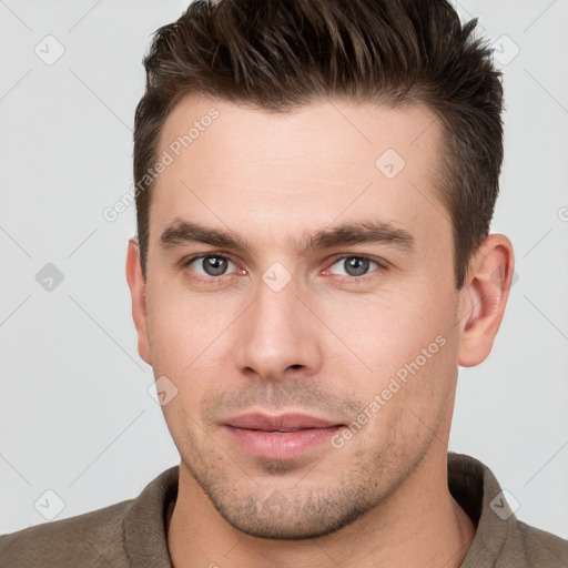 Neutral white young-adult male with short  brown hair and brown eyes