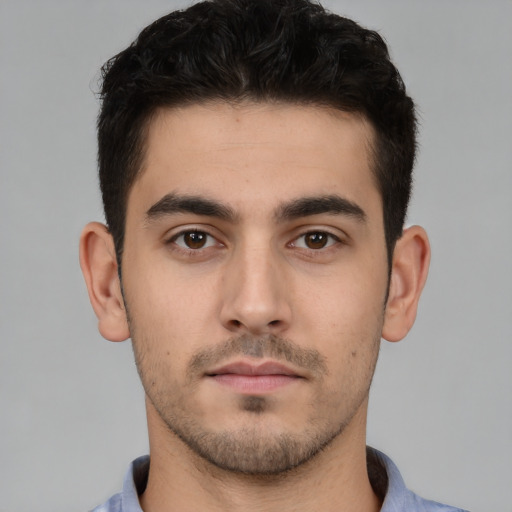 Neutral white young-adult male with short  black hair and brown eyes