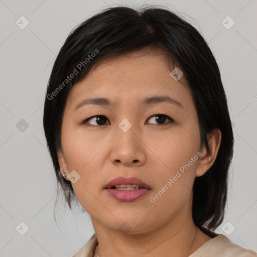 Neutral asian young-adult female with medium  brown hair and brown eyes