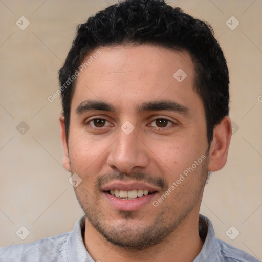 Joyful white young-adult male with short  black hair and brown eyes