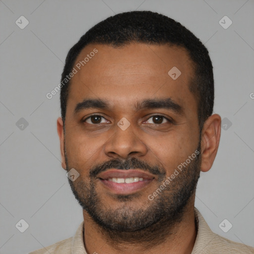 Joyful latino young-adult male with short  black hair and brown eyes