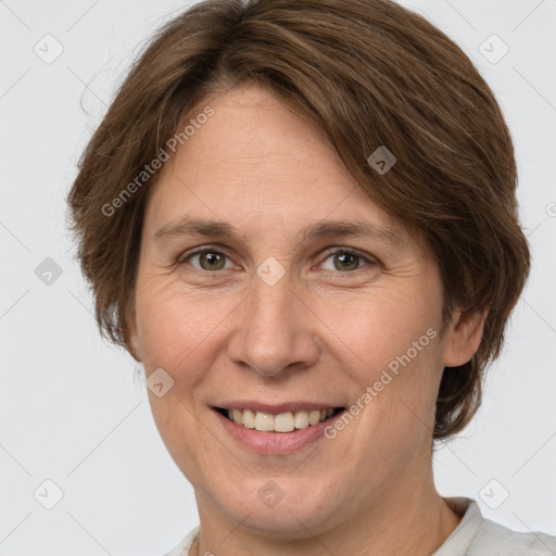 Joyful white adult female with short  brown hair and brown eyes