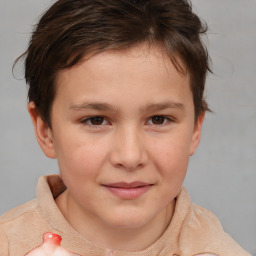 Joyful white child female with short  brown hair and brown eyes