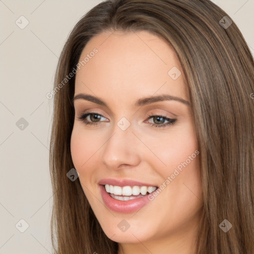 Joyful white young-adult female with long  brown hair and brown eyes