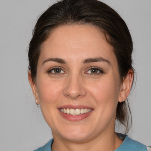 Joyful white young-adult female with medium  brown hair and brown eyes