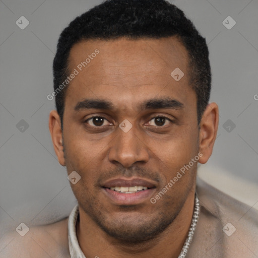 Joyful black young-adult male with short  black hair and brown eyes