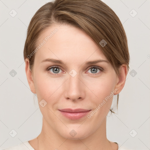 Joyful white young-adult female with medium  brown hair and grey eyes