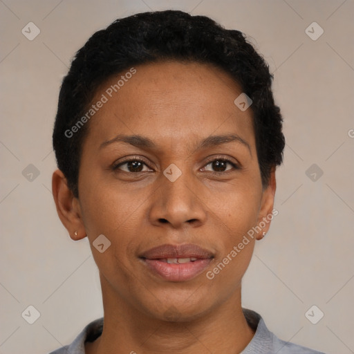 Joyful black adult female with short  black hair and brown eyes