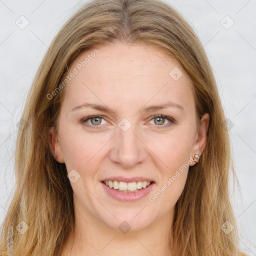 Joyful white young-adult female with long  brown hair and green eyes