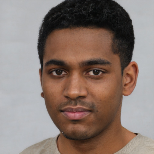 Neutral black young-adult male with short  black hair and brown eyes