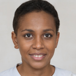 Joyful black young-adult female with short  brown hair and brown eyes