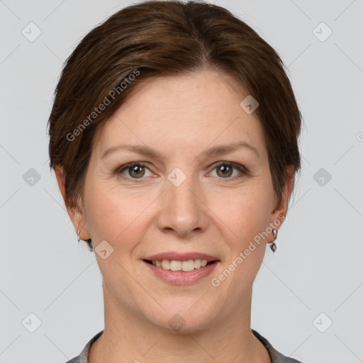 Joyful white adult female with short  brown hair and grey eyes