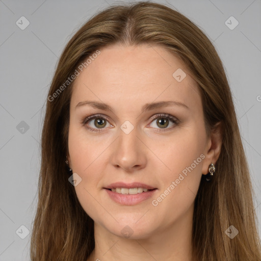 Joyful white young-adult female with long  brown hair and brown eyes