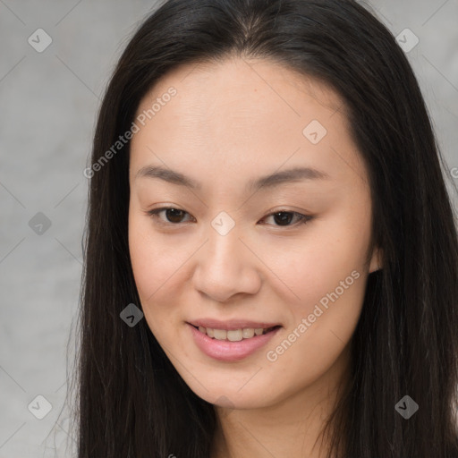 Joyful asian young-adult female with long  brown hair and brown eyes