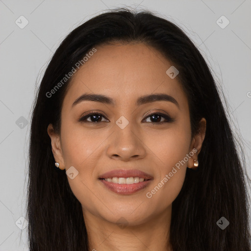 Joyful latino young-adult female with long  brown hair and brown eyes