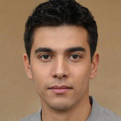 Neutral white young-adult male with short  black hair and brown eyes