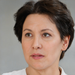 Joyful white adult female with short  brown hair and brown eyes