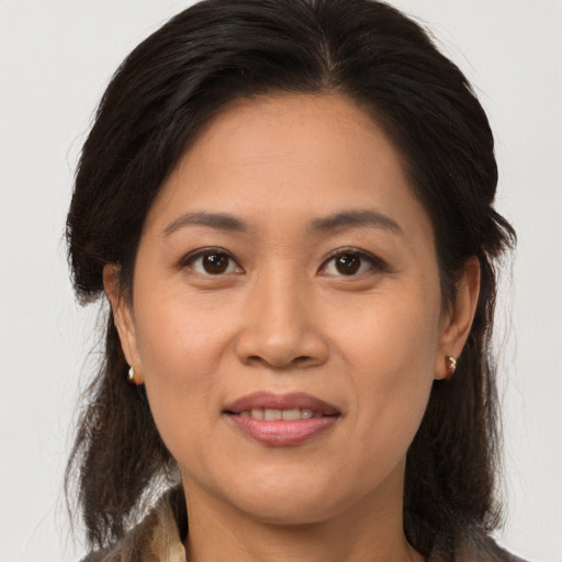 Joyful asian young-adult female with medium  brown hair and brown eyes